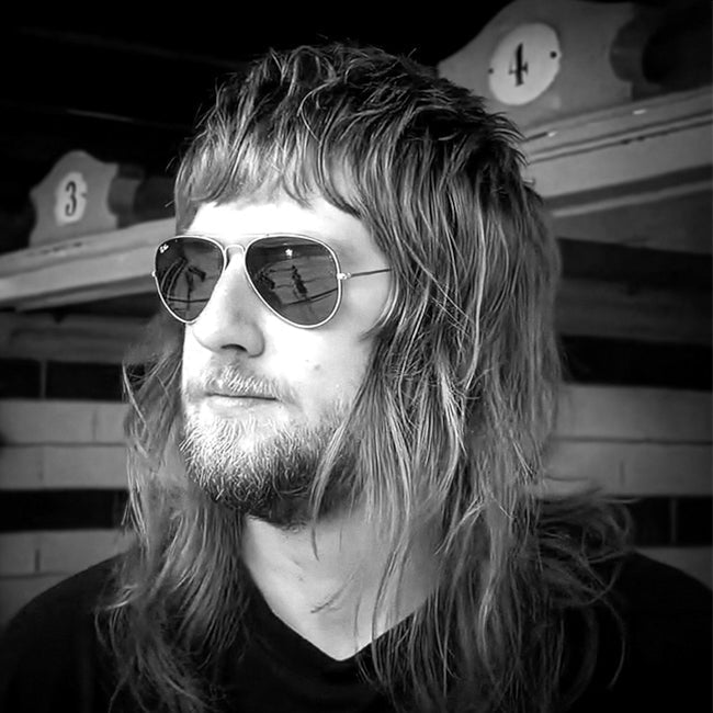 Man with Glasses and UK Rocker Hairstyle