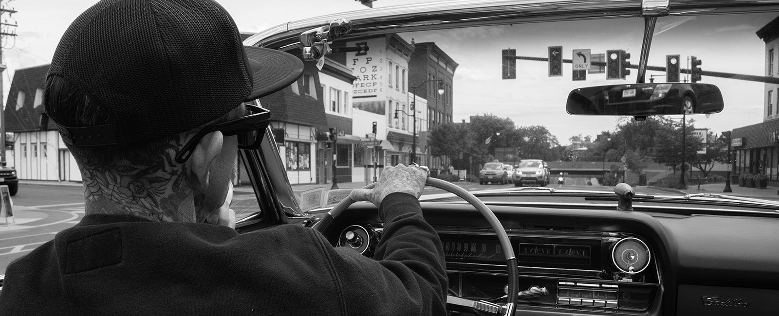 Mike Pugsly driving a convertible car